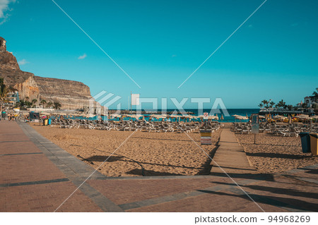 Beach in Canary Islands with rental loungers 94968269