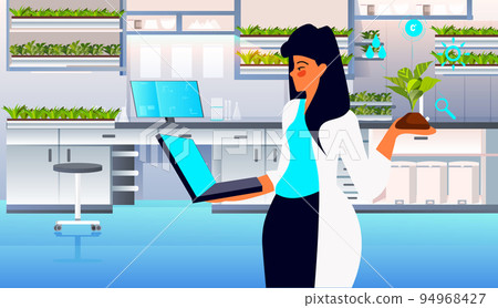 scientist woman examining green plant in lab responsibility of co2 emission environmental conservation 94968427