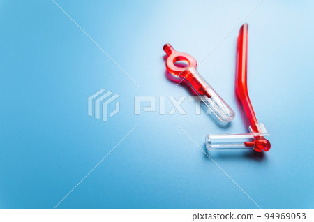 interdental orthodontic brushes for teeth of red color lie on a blue background with free space for your text. dental clinic banner interdental orthodontic brushes for teeth of red color lie on a blue background with free space for your text. dental clinic banner 94969053