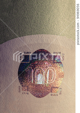 Hundred euro banknote protective hologram macro. The euro is currently the second most used currency in the world. It's been around since 2002 and has been growing steadily in popularity ever since Hundred euro banknote protective hologram macro. The euro is currently the second most used currency in the world. It's been around since 2002 and has been growing steadily in popularity ever since 94969056