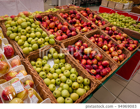 Apples boxes. Shopping mall red and green apple on shelves Apples boxes. Shopping mall red and green apple on shelves 94969083