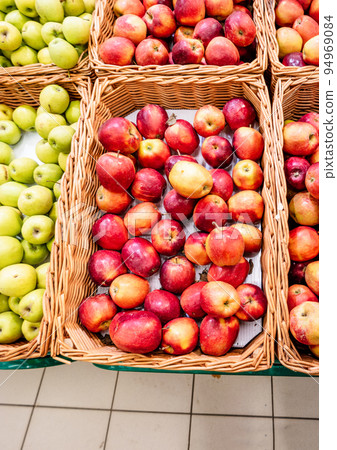 Boxes in supermarket full of red apples. Shopping mall food Boxes in supermarket full of red apples. Shopping mall food 94969084