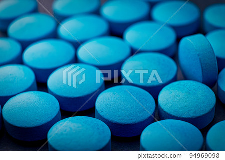 Blue pills tablets background macro image Blue pills tablets background macro image 94969098