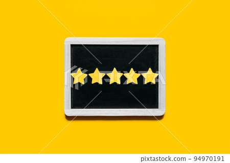 Customer Experience, Review Concept. Five yellow stars excellent rating in frame on yellow background. Customers Ratings and Reviews 94970191