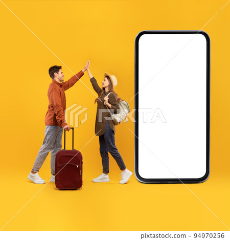 Tourists Spouses Near Large Phone Giving High Five, Yellow Background 94970256