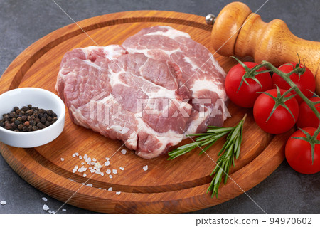 Meat on black surface 94970602