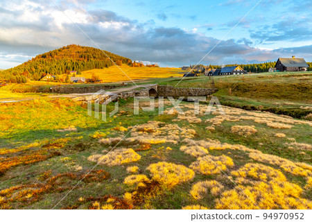 Bukovec mountain above Jizerka village at sunset time. Spring in Jizera Mountains, Czech Republic. 94970952