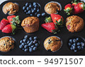Blueberry and strawberry muffins with berries. Close up. Top view. 94971507