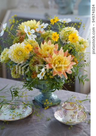 Yellow and orange flower arrangement Yellow and orange flower arrangement 94974884