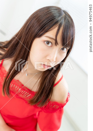 A woman in a red dress 94975463