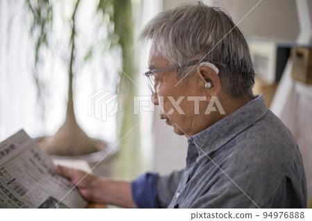 Japanese senior man living with a hearing aid 94976888