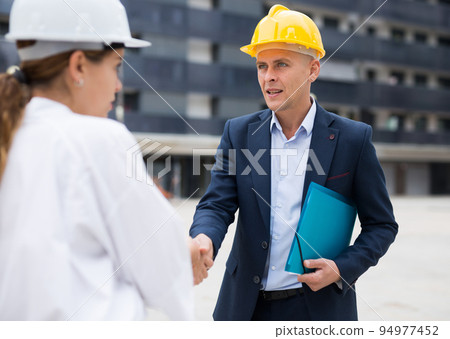 Portrait of two successful architects, friendly shaking hands 94977452
