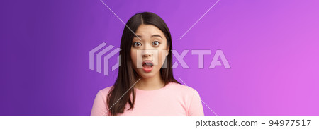 Close-up shocked gasping impressed asian brunette drop jaw stare camera impresssed, very surprised express full disbelief, speechless hearing astonishing news, stand purple background 94977517