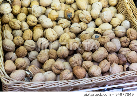 Whole walnuts in box at farmers market Whole walnuts in box at farmers market 94977849
