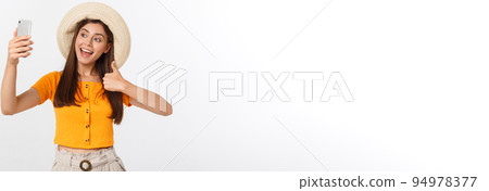 Young Caucasian woman enjoying the selfie with herself isolated on white background summer travel concept. Young Caucasian woman enjoying the selfie with herself isolated on white background summer travel concept. 94978377