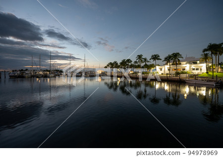 Miami City Hall and marina in morning twilight on calm summer morning. 94978969