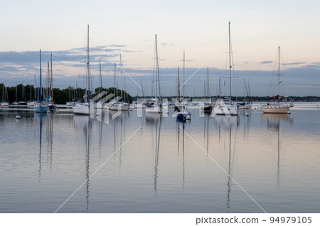 Sailboats in Dinner Key anchorage reflected in calm water of Biscayne Bay. Sailboats in Dinner Key anchorage reflected in calm water of Biscayne Bay. 94979105