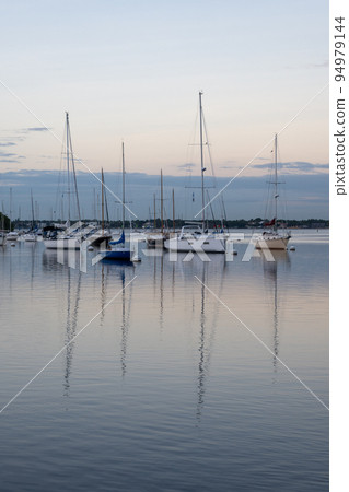 Sailboats in Dinner Key anchorage reflected in calm water of Biscayne Bay. Sailboats in Dinner Key anchorage reflected in calm water of Biscayne Bay. 94979144