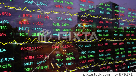 Stock market data processing against view of night city traffic 94979171