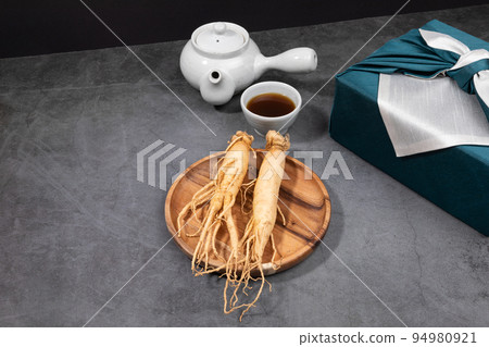 oriental, medicinal root plant, fresh ginseng wrapped in silk cloth for gift oriental, medicinal root plant, fresh ginseng wrapped in silk cloth for gift 94980921