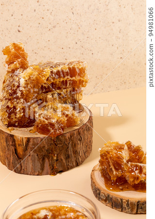 wood object, honeycomb, honey dipper stick wood object, honeycomb, honey dipper stick 94981066