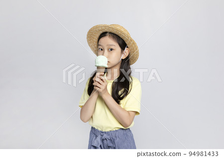 Korean young girl wearing gym clothes in white background studio__holding an ice cream 94981433