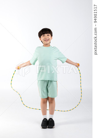 Korean young girl wearing gym clothes in white background studio__jump rope 94981517