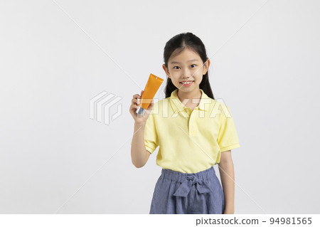 Korean young girl wearing gym clothes in white background studio__holding sunscreen, sunblock Korean young girl wearing gym clothes in white background studio__holding sunscreen, sunblock 94981565
