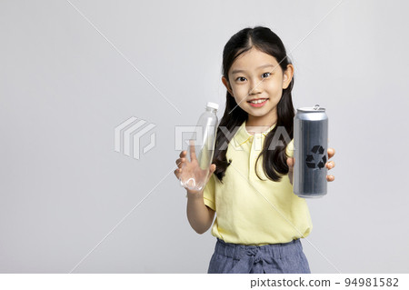 Korean young girl wearing gym clothes in white background studio__holding plastic bottles Korean young girl wearing gym clothes in white background studio__holding plastic bottles 94981582