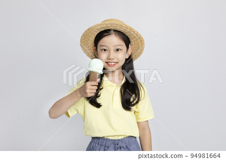 Korean young girl wearing gym clothes in white background studio__holding an ice cream 94981664