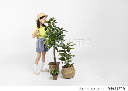 Korean young girl wearing gym clothes in white background studio__raising flower pot Korean young girl wearing gym clothes in white background studio__raising flower pot 94981729