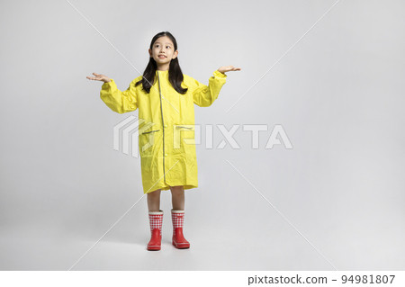 cute young Korean girl, rainy season concept in white background studio__raindrops falling in the raincoat cute young Korean girl, rainy season concept in white background studio__raindrops falling in the raincoat 94981807
