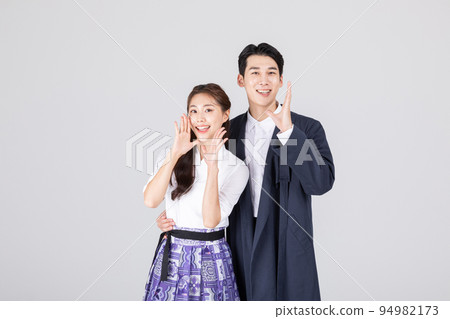 Korean young couple, man and woman wearing modern Hanbok_talking 94982173