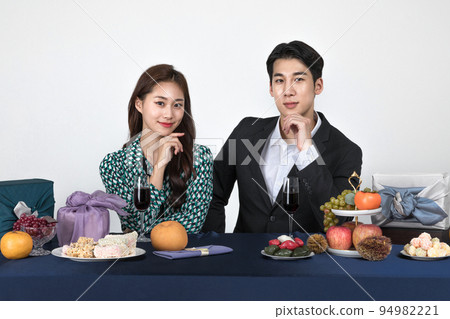 Korean young couple, man and woman wearing modern Hanbok_looking forward with smiling Korean young couple, man and woman wearing modern Hanbok_looking forward with smiling 94982221