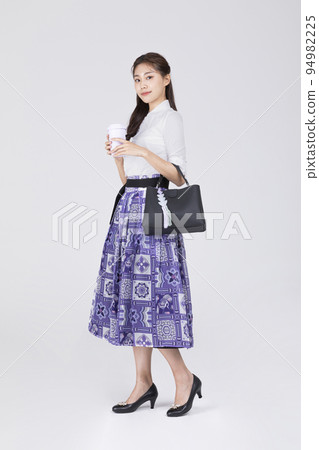 beautiful Korean woman in 20s wearing modern Hanbok_holding a bang and tumbler beautiful Korean woman in 20s wearing modern Hanbok_holding a bang and tumbler 94982225
