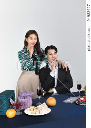 Korean young couple, man and woman wearing modern Hanbok_smiling couple 94982627