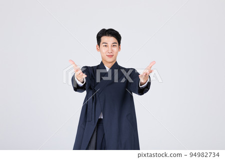 goodlooking Korean young man in 20s wearing modern Hanbok wearing hanbok_hand motion goodlooking Korean young man in 20s wearing modern Hanbok wearing hanbok_hand motion 94982734