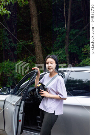 two Korean Asian female friends in 20s hiking and plogging in mountain__getting out of the car two Korean Asian female friends in 20s hiking and plogging in mountain__getting out of the car 94982756