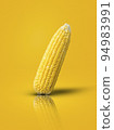 sweet corn laid on a yellow background 94983991