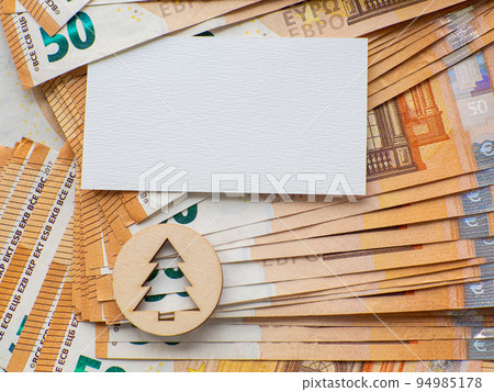 Copy space with christmas tree on the background of fifty euros banknotes 94985178