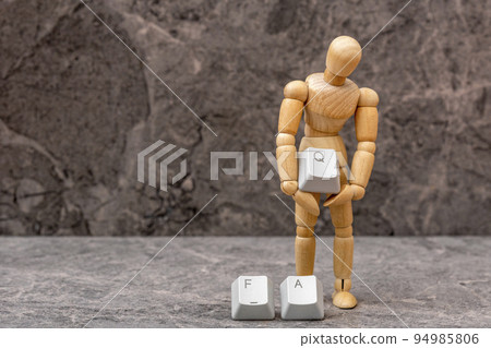 Dummy puts computer keyboard key with letter Q from the word FAQ Dummy puts computer keyboard key with letter Q from the word FAQ 94985806