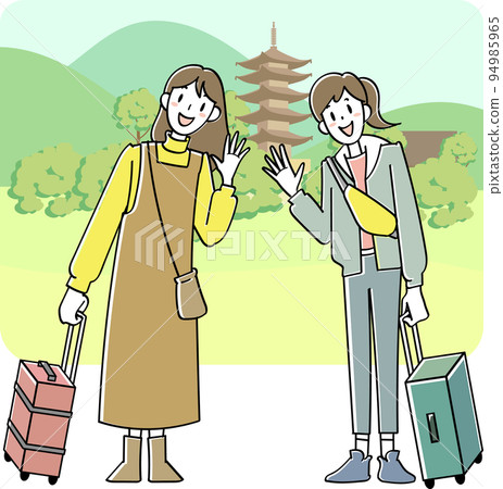 Two young women traveling in an ancient city 94985965