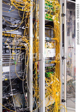 data center with servers and fiber optics cables 94986355