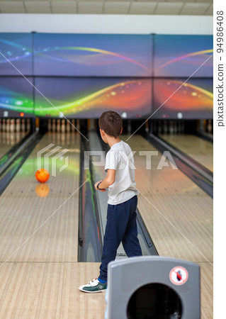 Paths with balls and pins for bowling. A fun game for the company Paths with balls and pins for bowling. A fun game for the company 94986408