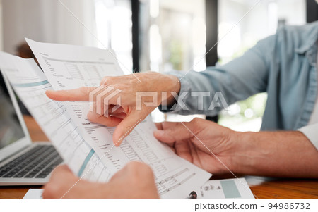 Finance, budget and retirement people planning paperwork, savings or bills for wealth, investment and pension income. Senior couple hands reading financial document, tax management or life insurance 94986732