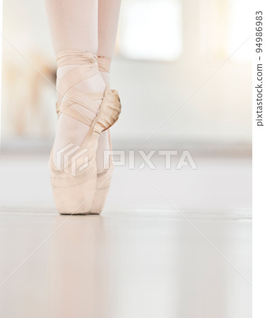 Zoom of dancer feet on floor, ballet shoe and tip of toes, show posture and balance at dance practice. Closeup of girl dancing in studio training, in professional performance or recital in Ukraine Zoom of dancer feet on floor, ballet shoe and tip of toes, show posture and balance at dance practice. Closeup of girl dancing in studio training, in professional performance or recital in Ukraine 94986983