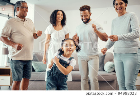 Happy, family and dancing in playful living room fun together with entertainment in happiness at home. Group of people in relationship bonding, smiling and joyful funny dance at the house 94988028