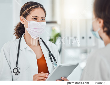 Covid, vaccine and tablet with a doctor talking to a patient in a hospital during an appointment or schedule for a booster shot. Trust, consulting and insurance with a health professional in a clinic 94988369