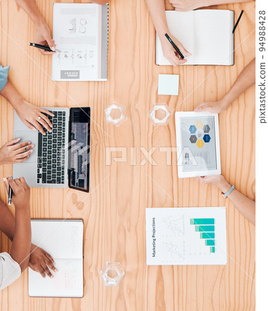 Collaboration, marketing and technology with a business team during a meeting in their office with a laptop, tablet and paperwork. Teamwork and advertising with a group planning for future growth Collaboration, marketing and technology with a business team during a meeting in their office with a laptop, tablet and paperwork. Teamwork and advertising with a group planning for future growth 94988428