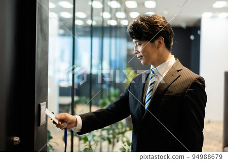 A man entering a high security office 94988679
